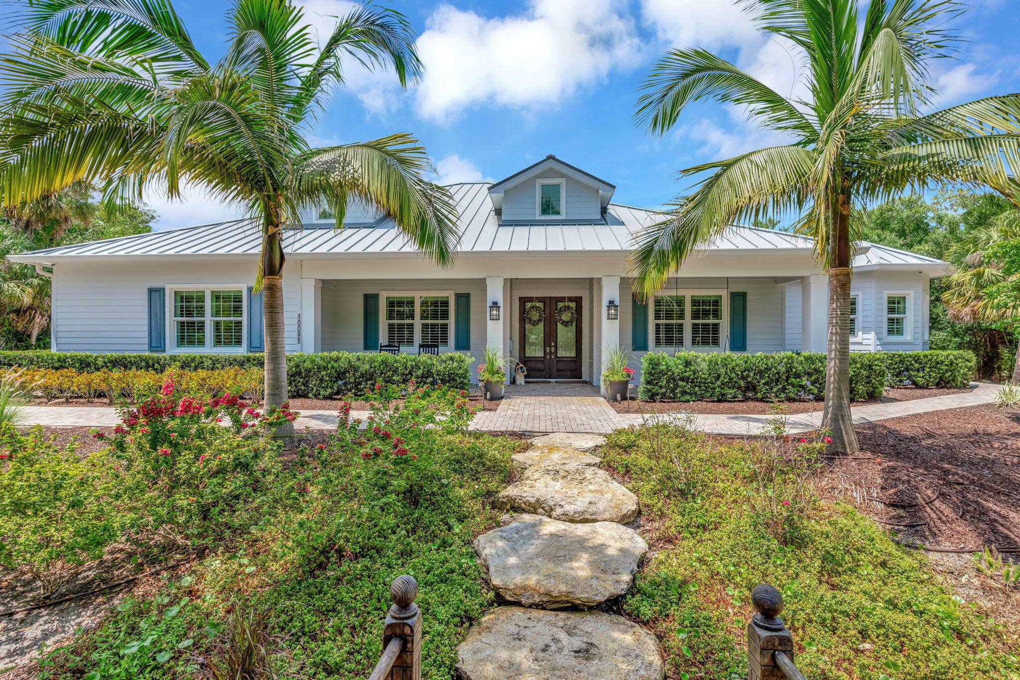 This 2018 custom built 4 4 4 home with a screened, heated, salt water pool sits on a VERY private 2.