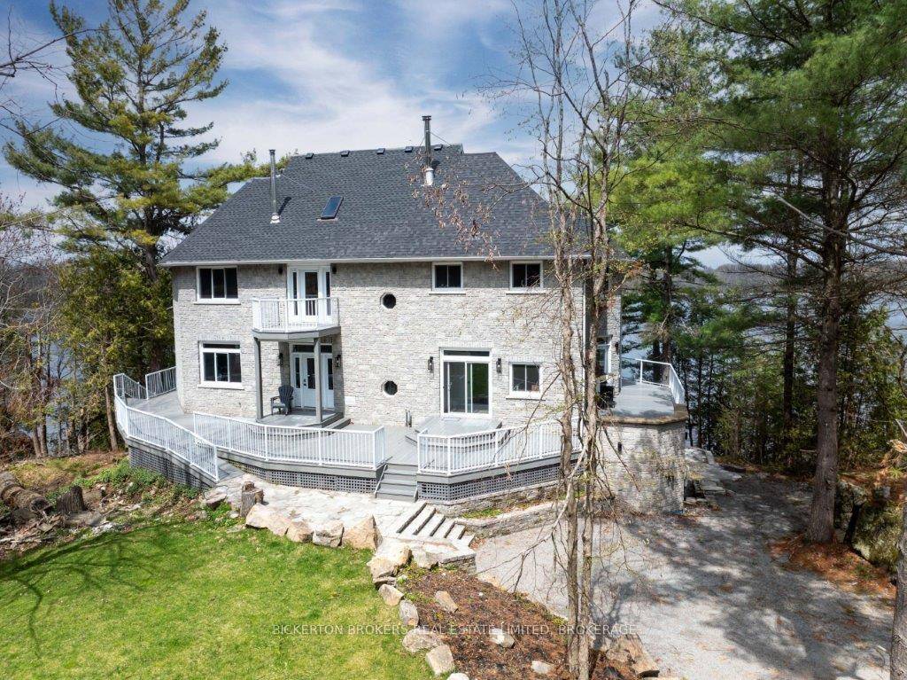 Nestled at 934 Burma Lane on Charleston Lake, this stunning lakefront house offers the perfect blend of modern comfort and natural beauty.