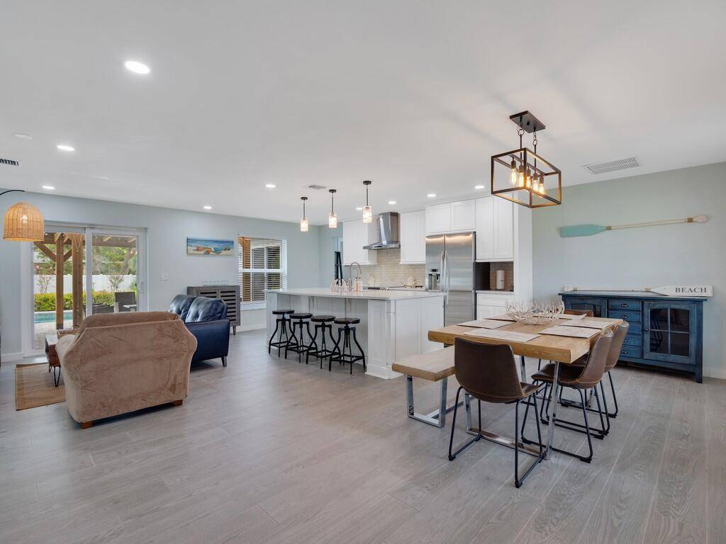 Newly remodeled, comfortable central beach pool home with fenced in back yard and heated pool.