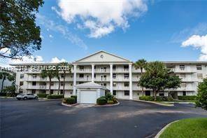 Wake up every morning to peaceful golf course views in one of the most beautifully updated condos in the prestigious Private Country Club Community of Pine Island Ridge.
