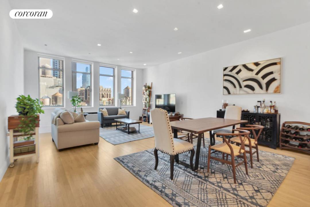 A stunning prewar CONDO loft in the famed Chelsea Mercantile featuring an open kitchen, primary bedroom suite, and an oversized den home office convertible to an interior BR with 2 ...