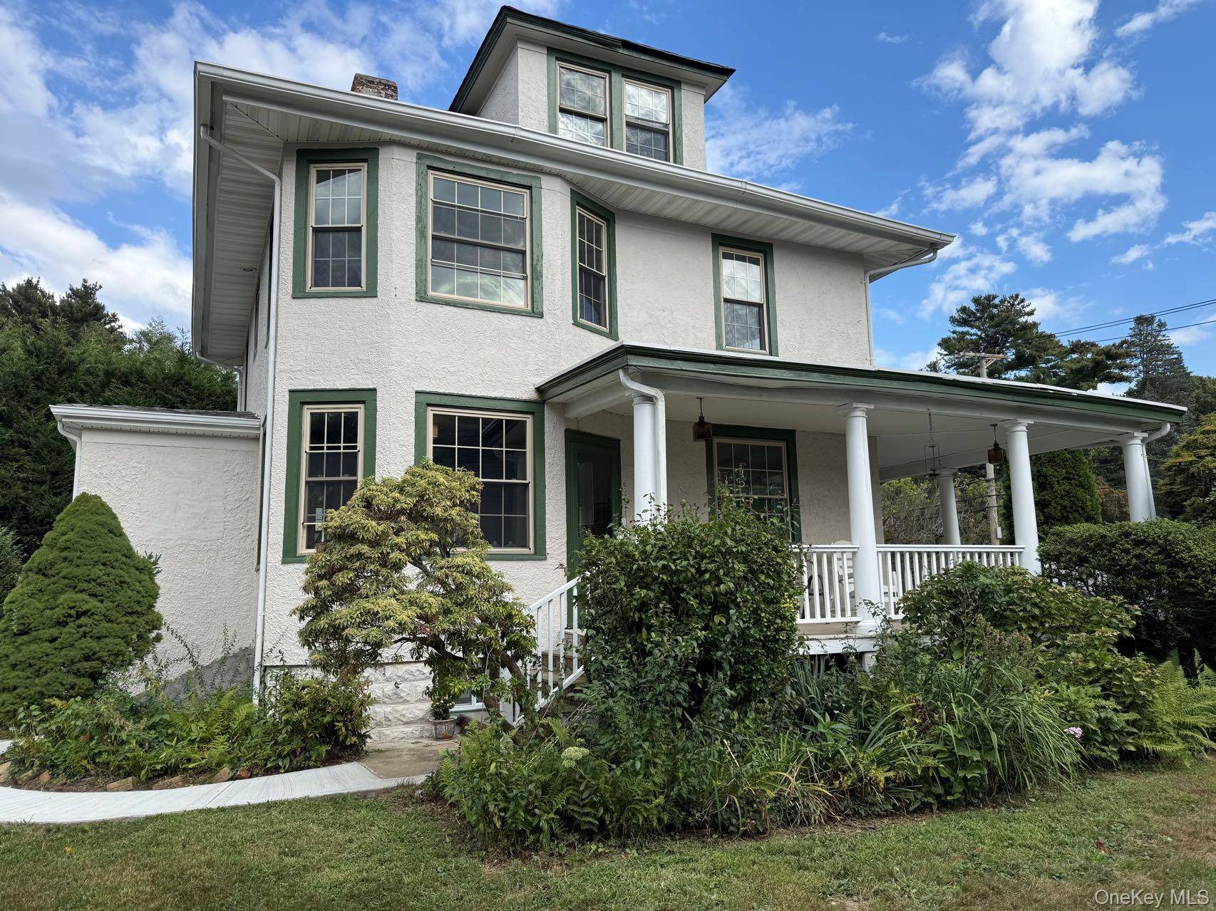 Welcome to this beautifully renovated 1918 Colonial, blending timeless charm with modern updates.