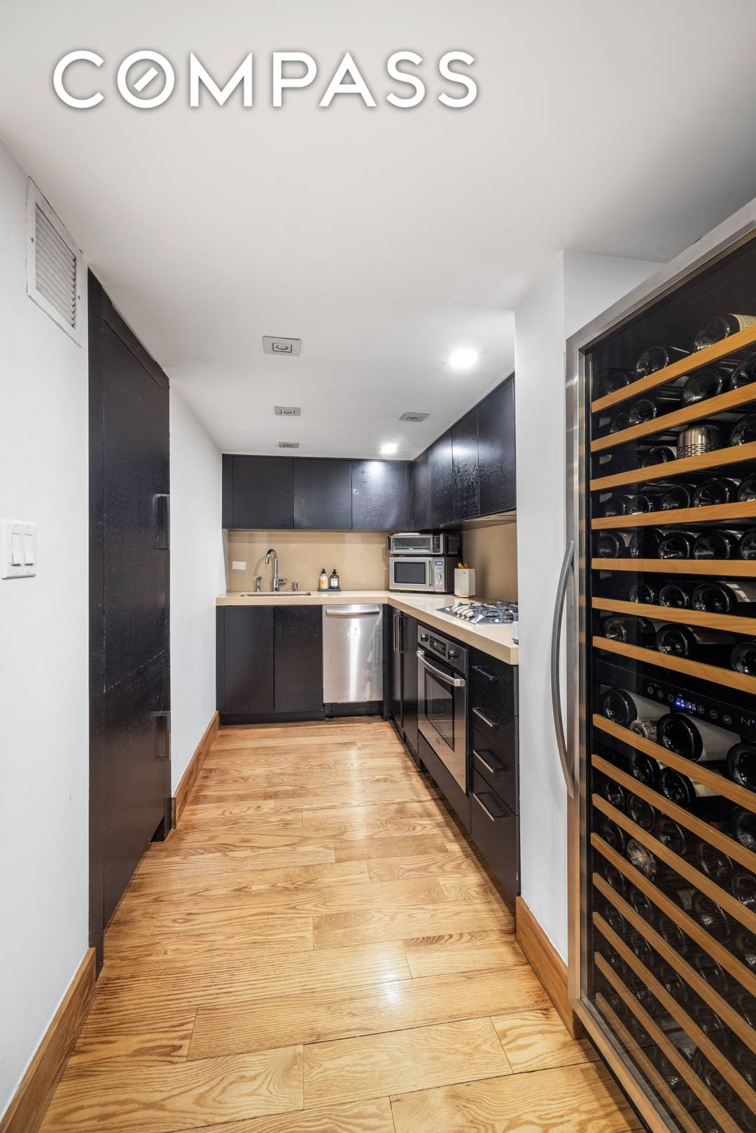 Welcome to apartment 3R, a 1 bed with dramatic interiors featuring soaring 14 foot ceilings, a wall of oversized windows, and a custom metal staircase leading to a lofted bedroom ...