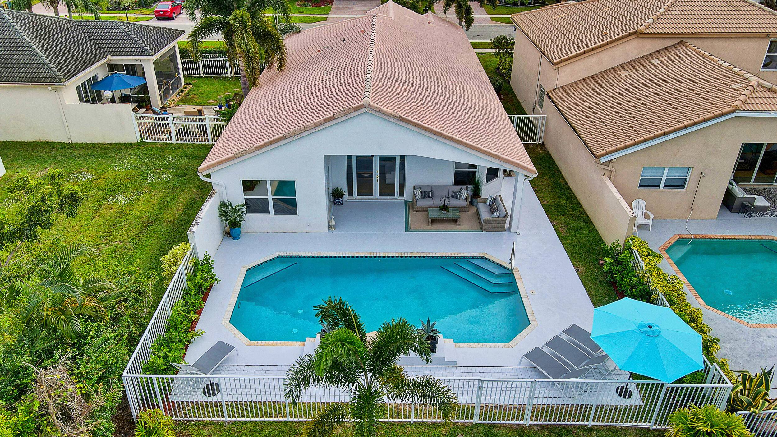 Gorgeous updated 3 bedrooms, 2 baths single story home with incredible waterfront view and private salt water heated pool located in sought after Isles of Wellington !