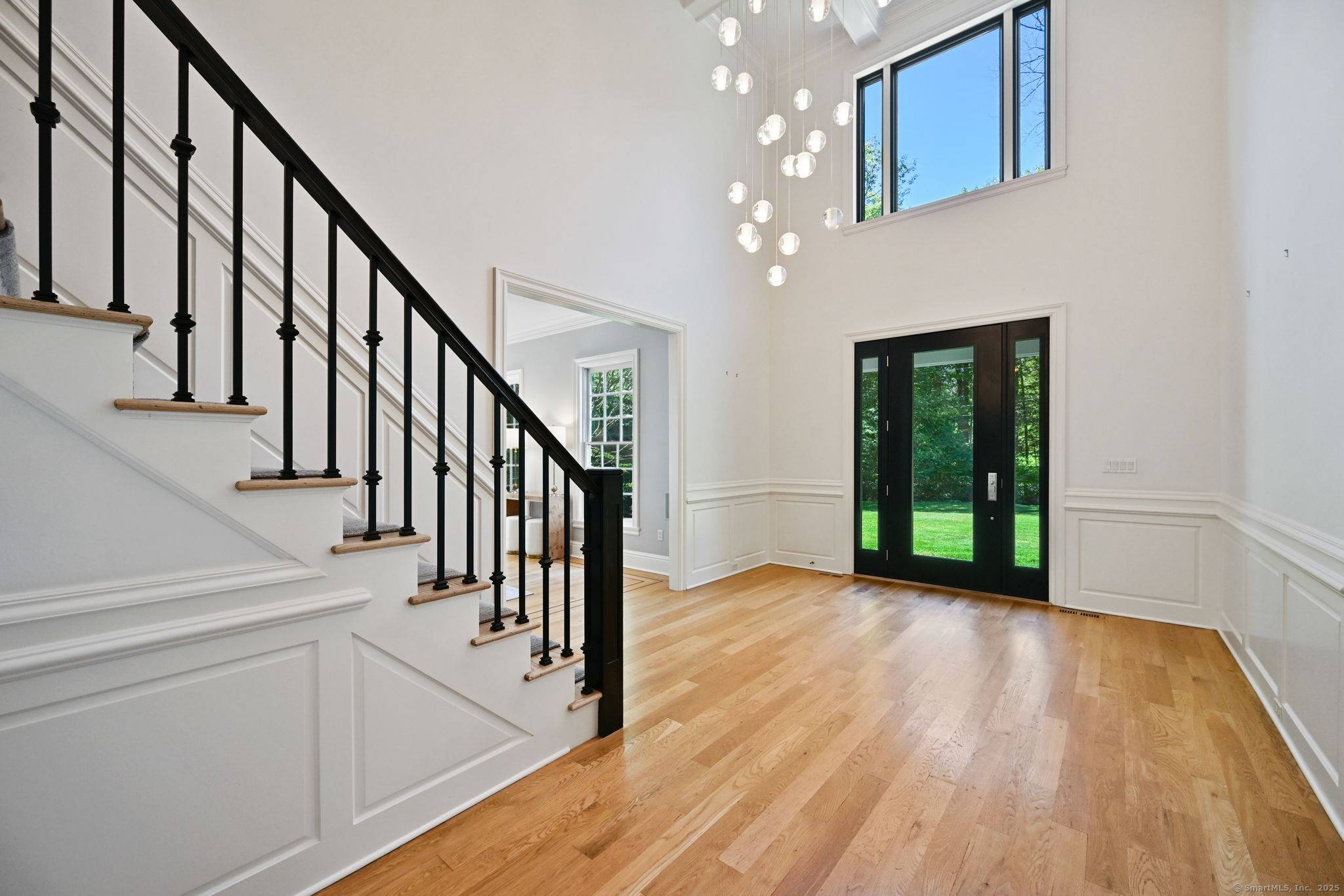 Set on 2. 28 beautifully landscaped acres in a premier neighborhood, this stunning Colonial showcases custom millwork, soaring windows, and sun filled spaces throughout.