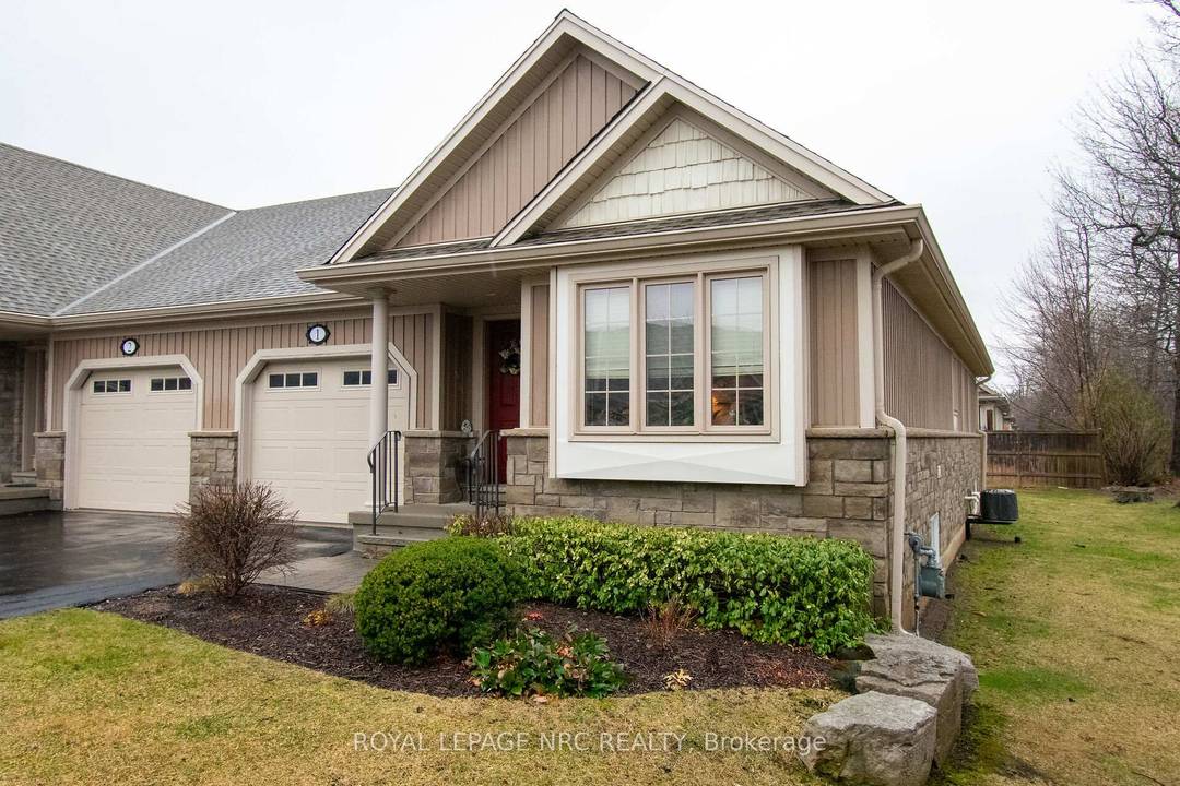 WELL CARED FOR END UNIT VACANT LAND CONDO TOWNHOME IN QUIET BROCKWOOD TERRACE 16 UNIT COMPLEX.