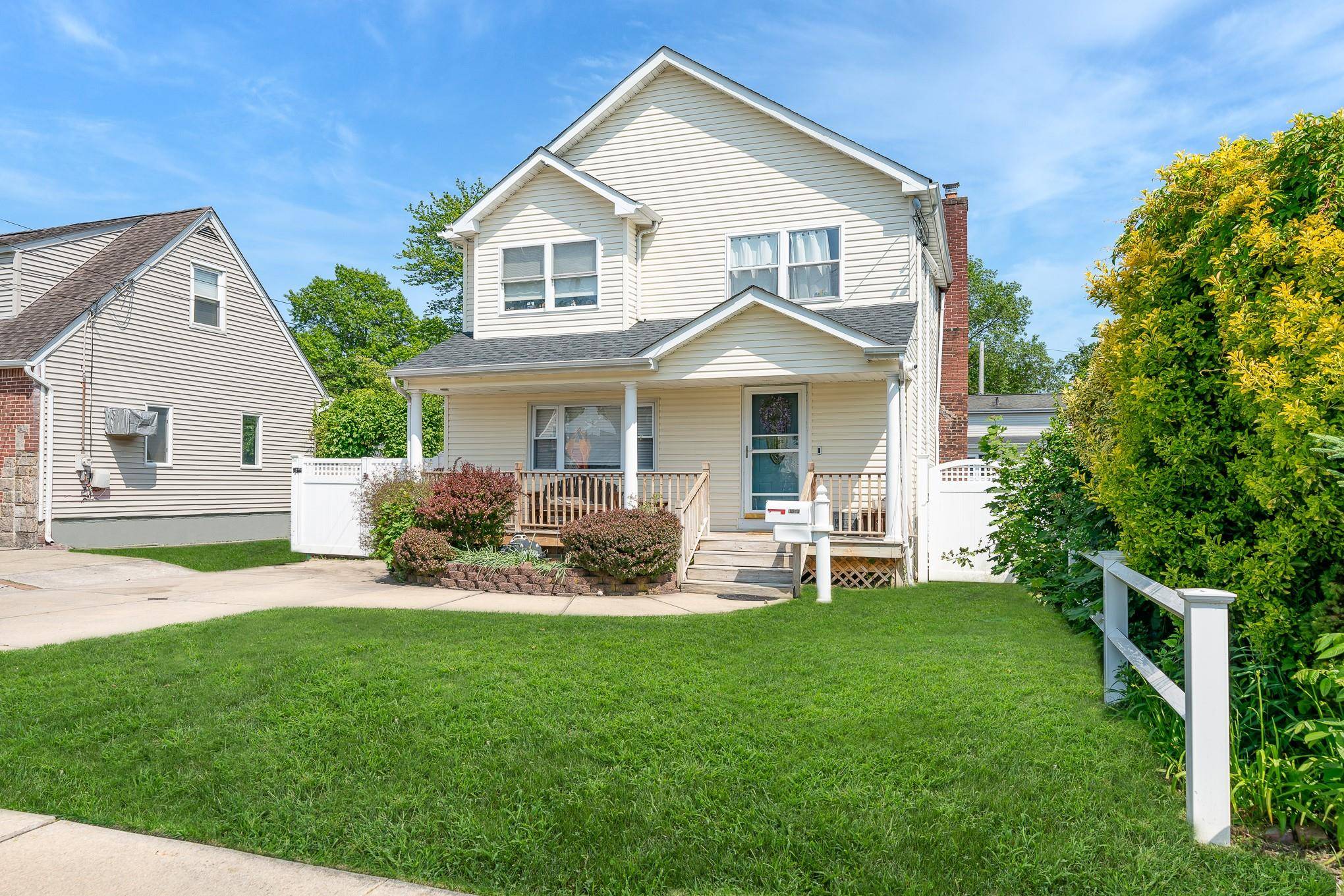 Charming Colonial Styled Home with Front Porch and Open Concept Living on the First Floor.