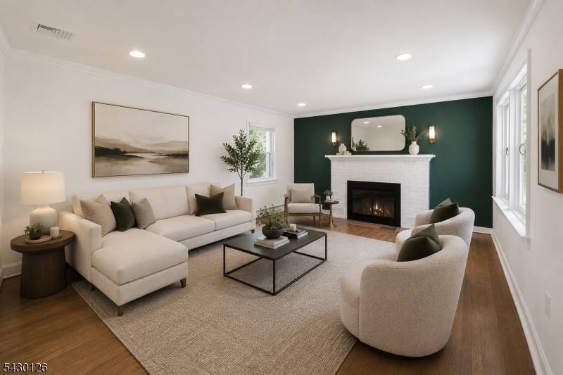 Completely renovated in 2021, this sophisticated ranch style residence is set on a premium 1.