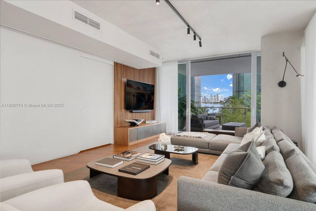 Step Inside With Me ! A statement in contemporary design, this designer flow through corner residence showcases water views and an ideal floorplan.