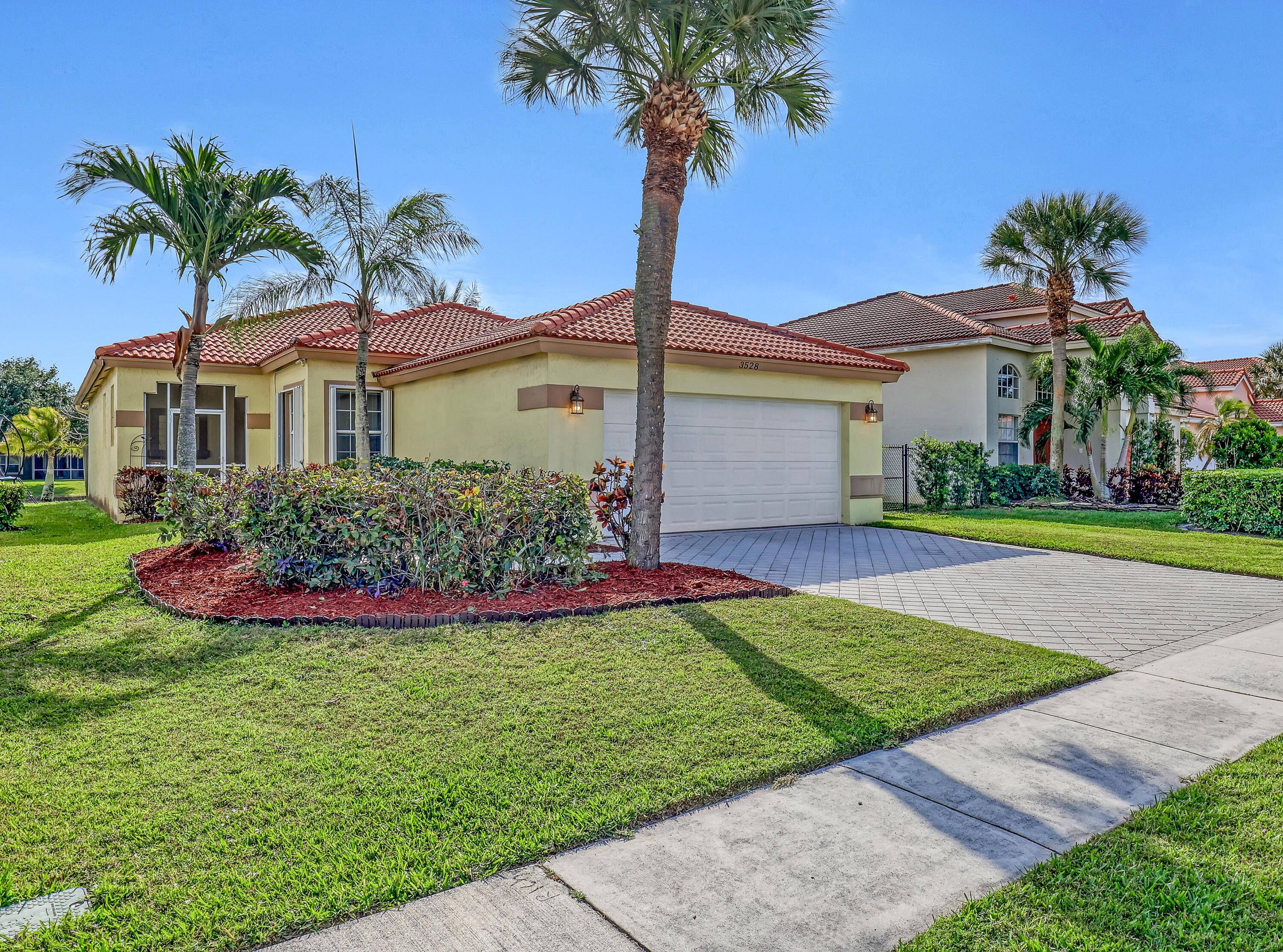BRAND NEW ROOF... Must see 3 bedroom 2 bath home on a lake in the gated Grand Isles community in Wellington, FL.