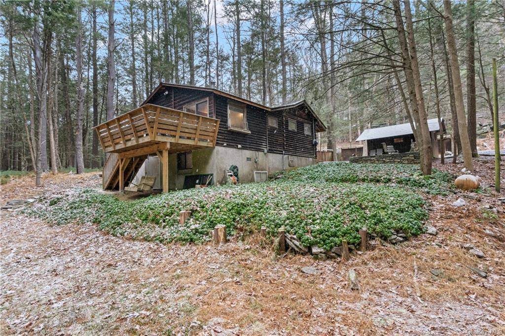 Escape to your own private oasis with this charming cottage nestled on just under 1 acre of serene land, surrounded by the soothing sounds of a beautiful roaring brook.