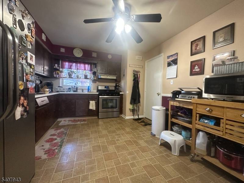 Value add two family opportunity in Lyndhurst featuring a finished, ground level walk out basement with full bath and attached two car garage.