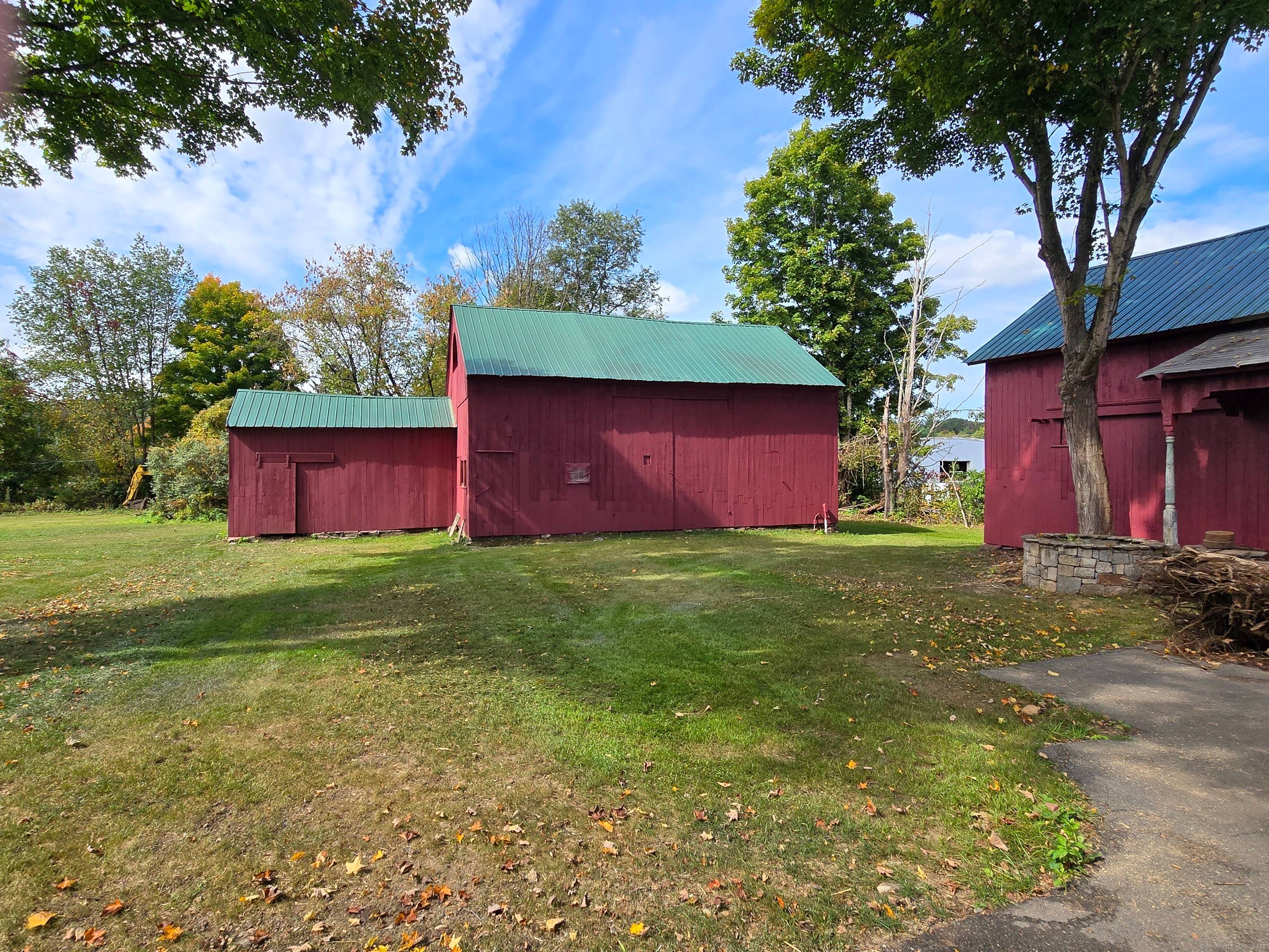 An Antique home with two large barns that offers a unique opportunity for a mixed use development.