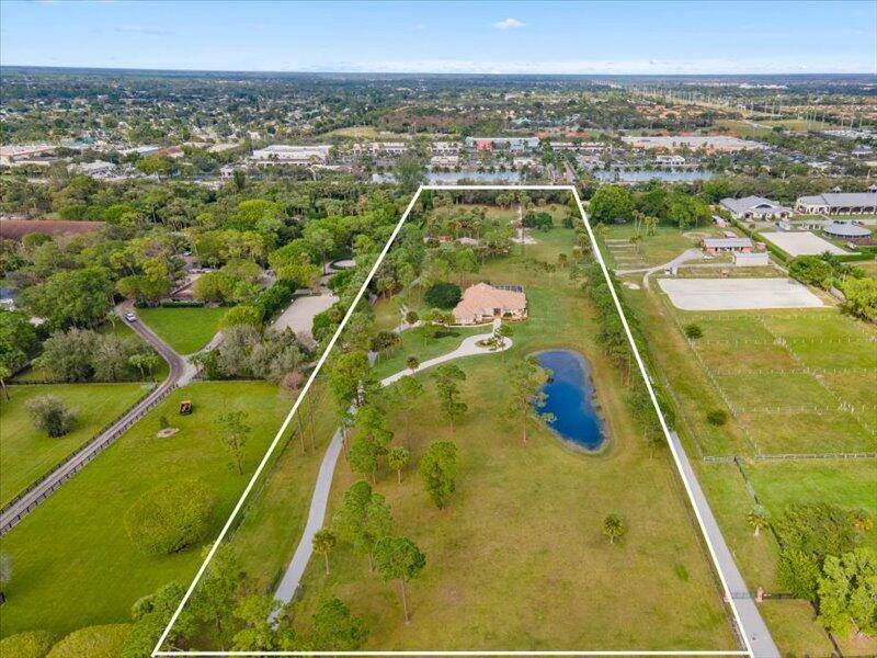 Stunning equestrian estate right in the heart of Wellington's number one dressage community !