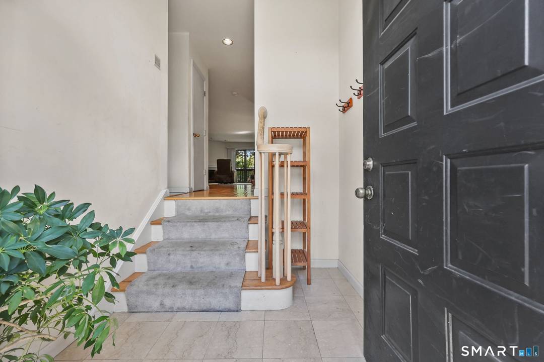 Welcome to this beautifully maintained end unit townhouse located in the desirable Chesterfield community of Stamford, CT.