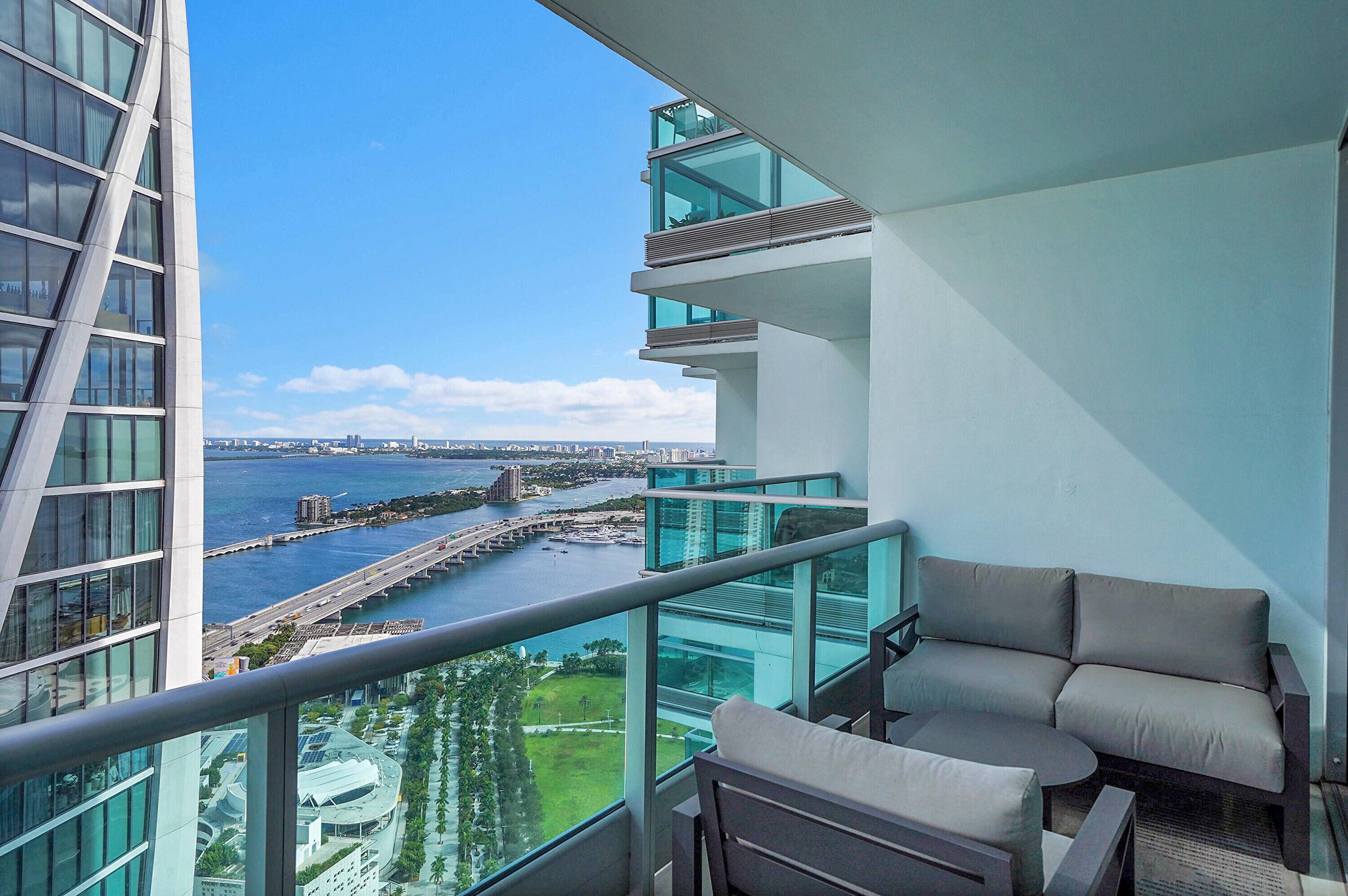 Amazing views from every room Beautiful 48th floor corner unit at 900 Biscayne Bay a light filled, modern 2 bed 2 bath 1 2 guest bath residence featuring marble countertops, ...