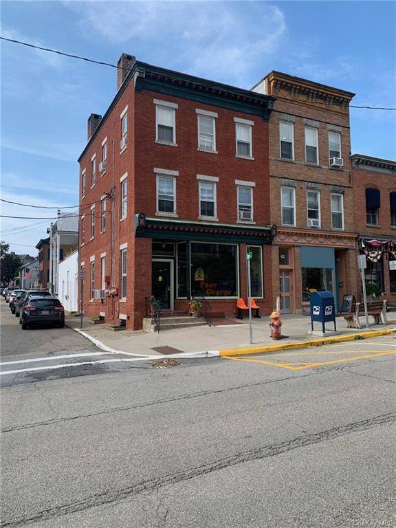 Village of Cold Spring, Main Street, 3 story brick multi family mixed use building with four 4 residential one bedroom apartments and two 2 commercial storefronts.