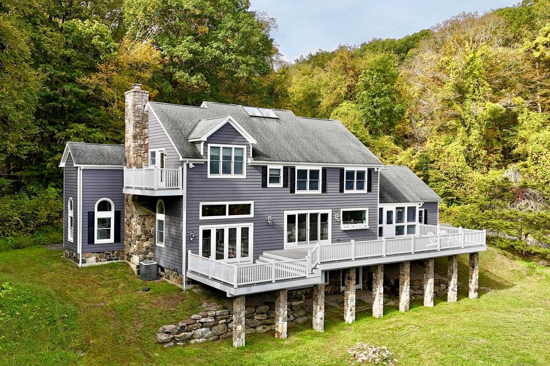 Escape to this mountaintop retreat with sweeping, unobstructed views located off one of the most desirable scenic roads in the Litchfield Hills.