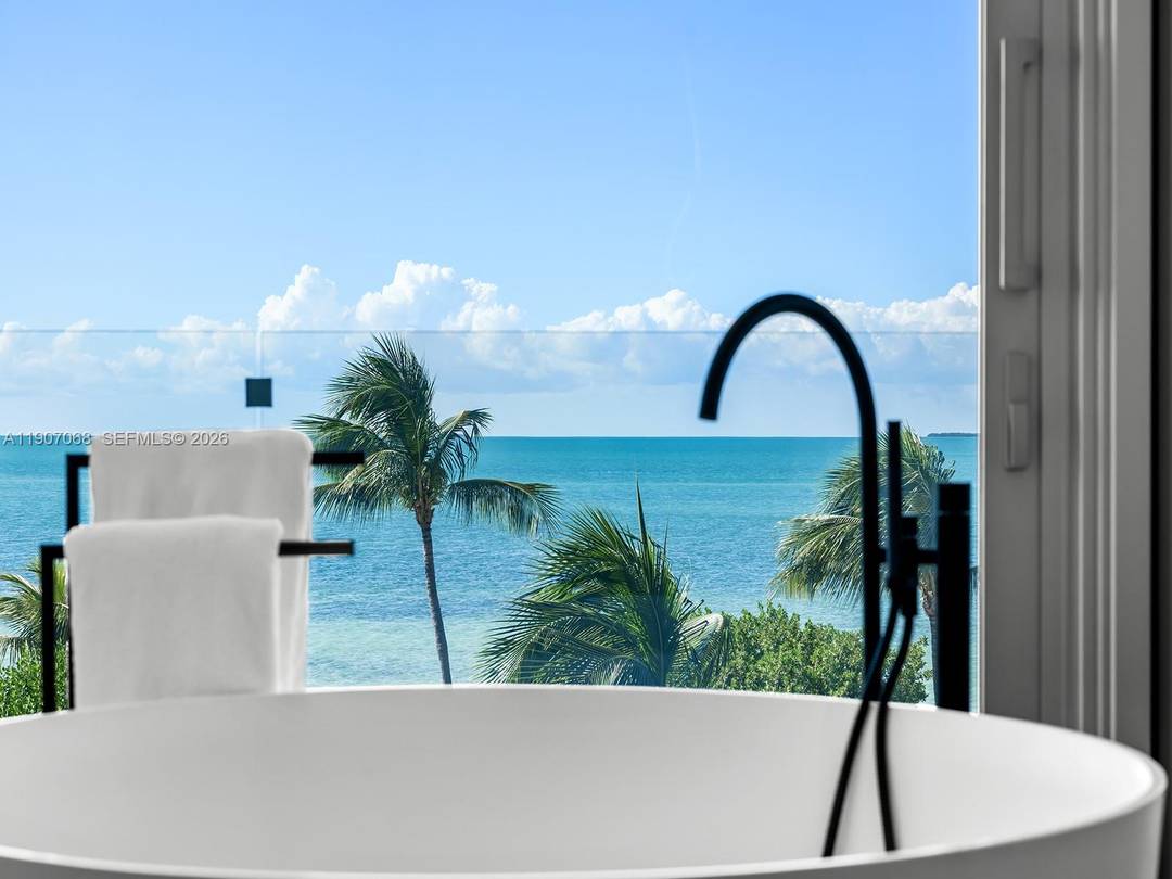 A rare architectural masterpiece by renowned architect Max Strang, this modern coastal estate in Port Antigua, Islamorada, redefines luxury waterfront living.