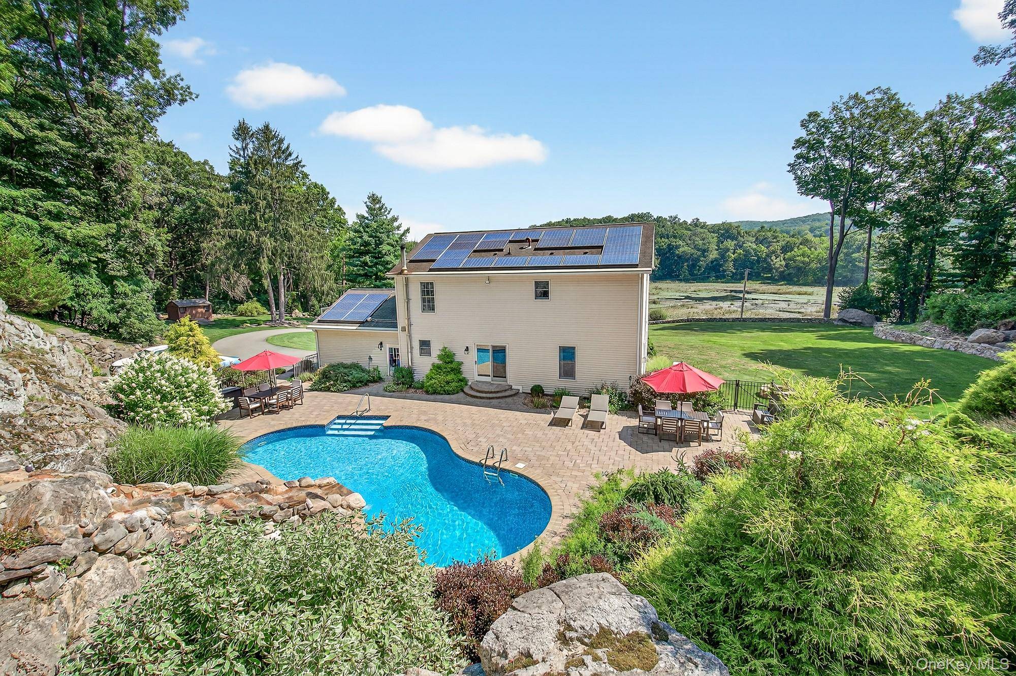 Welcome home to this beautifully updated home overlooking Barrett Pond, a magical bird sanctuary a perfect setting in nature !