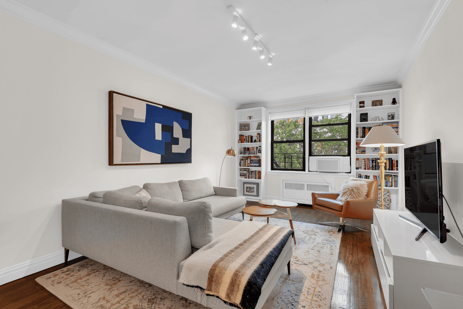 This pristine two bedroom, two bathroom home offers a smart, light filled layout with northern and southern exposures and charming treetop views.