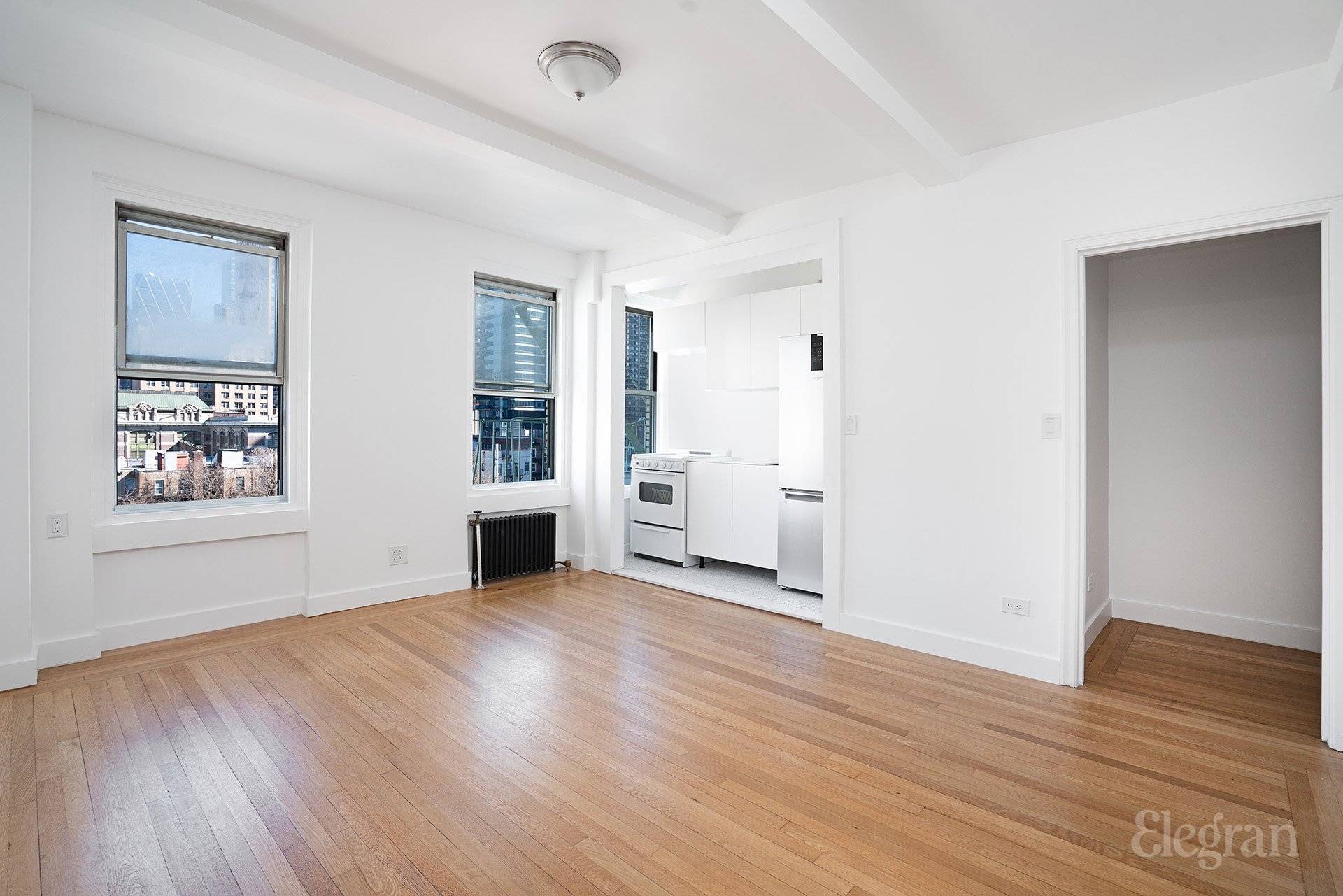 This is your chance to secure a comfortable and stylish Theater District abode set high on the 10th floor of the historic Whitby building.