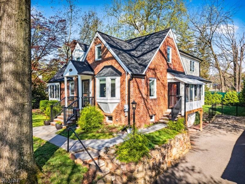 This picture perfect brick home feels straight out of a storybook, with timeless curb appeal and thoughtfully updated interiors that blend charm with modern comfort.