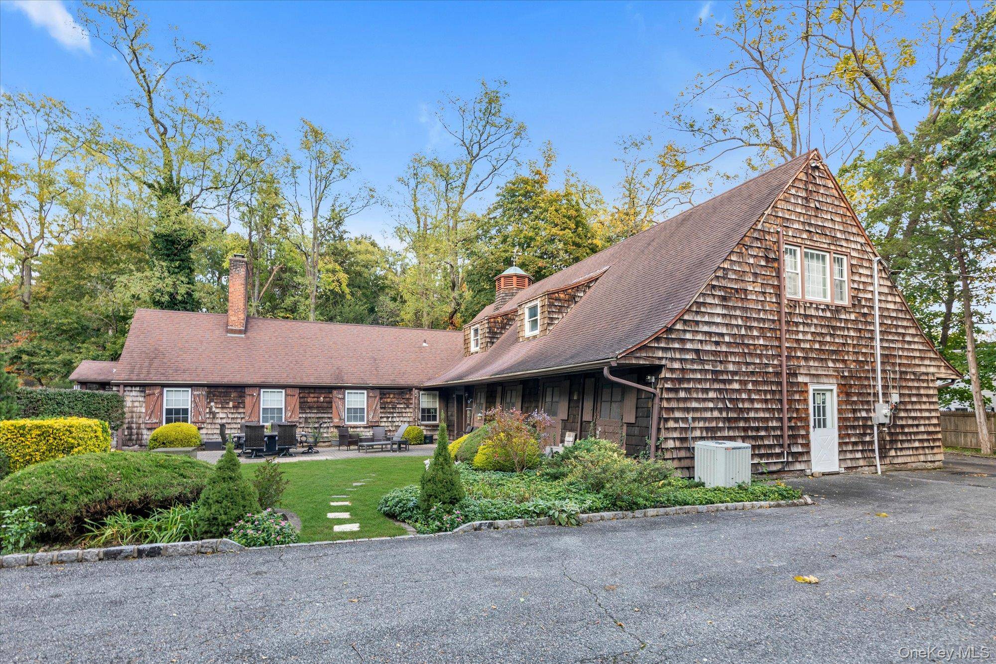 Discover this private 2 acre estate nestled in the prestigious Brookville Village, located within the top rated Jericho School District.