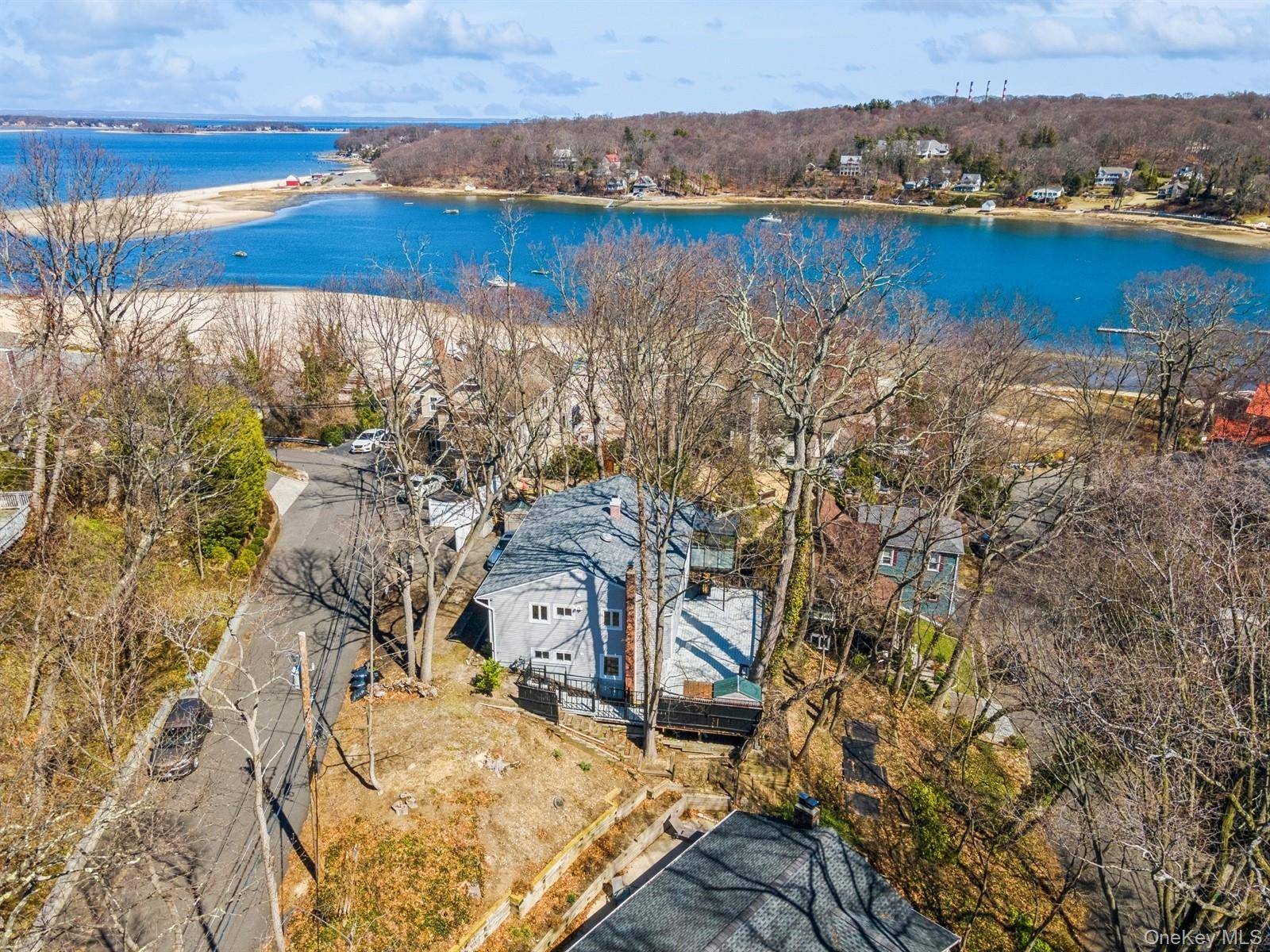Luxurious coastal living in this gut renovated 5 bed, 3 bath hi ranch with year round water views !