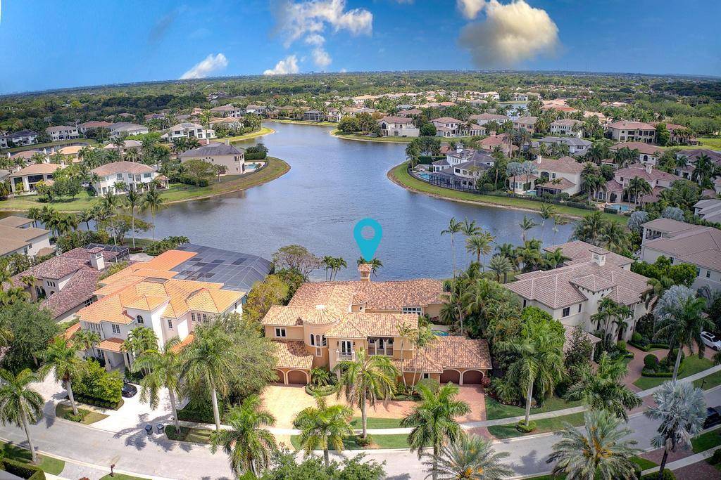 Stunning Lakefront Courtyard Estate with Resort Style LivingThis exquisite estate offers resort style lakefront living with a spacious 4 car garage and an expansive courtyard design.