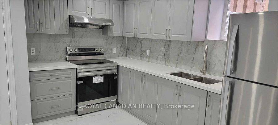 Beautiful legal basement apartment with a separate side entrance, offering 2 spacious bedrooms, 1 modern bathroom, and a large open concept living and kitchen area.