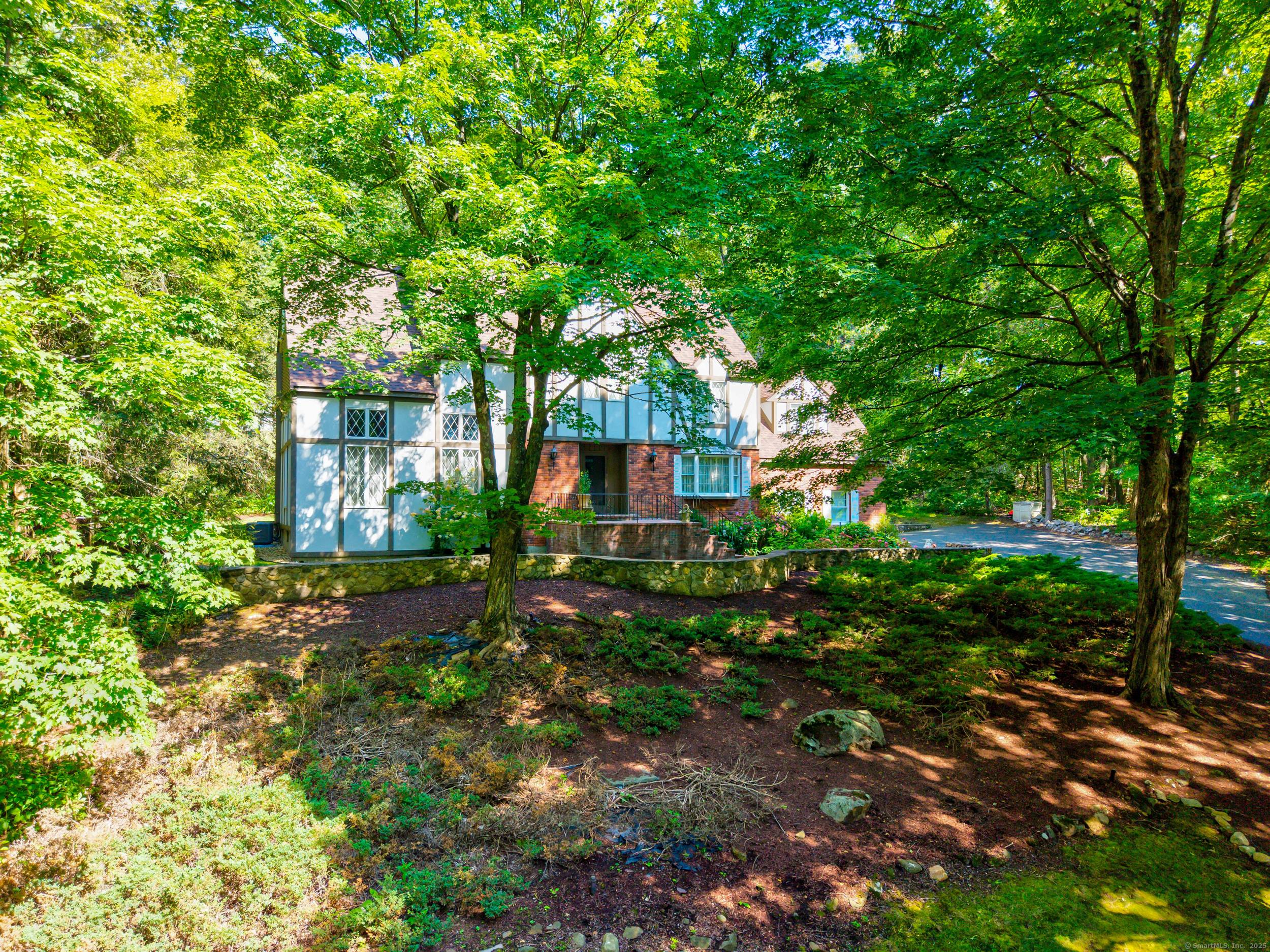 Welcome to this beautifully maintained Tudor style home nestled in one of Farmington's most sought after neighborhoods.