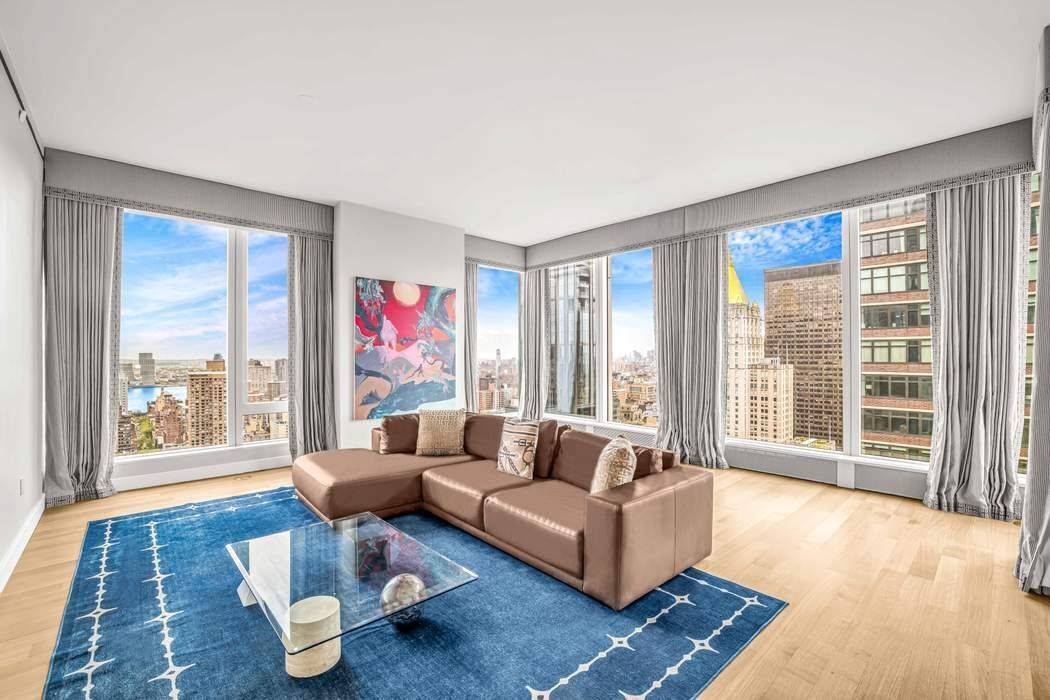 Sun Filled Corner Residence with Panoramic Views at Madison House This exceptional two bedroom, two and a half bath corner residence offers approximately 1, 650 square feet of refined living, ...