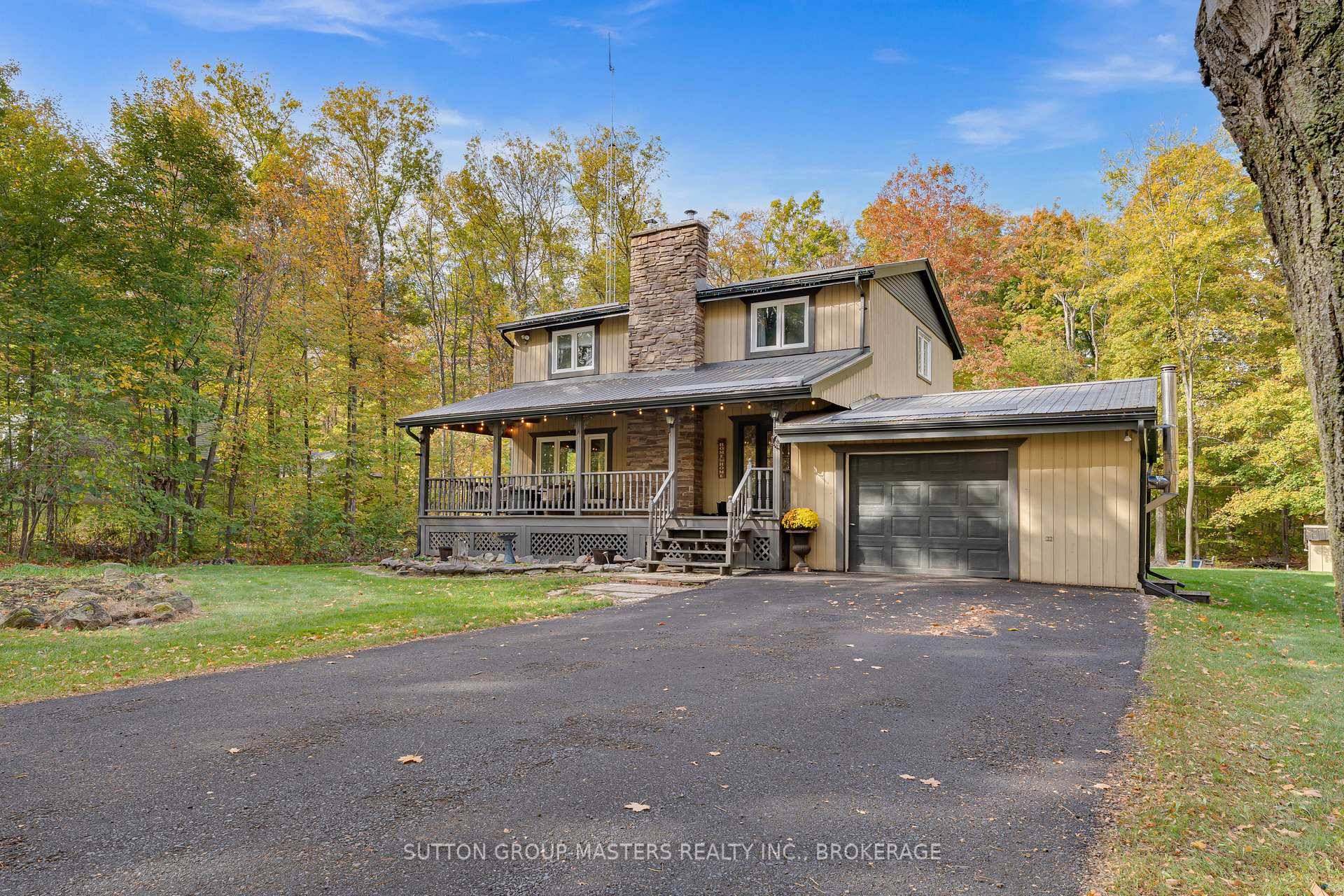 Welcome to 2382 Sands Road in Battersea a charming home surrounded by mature trees and steps from Storrington Public School and local trails.