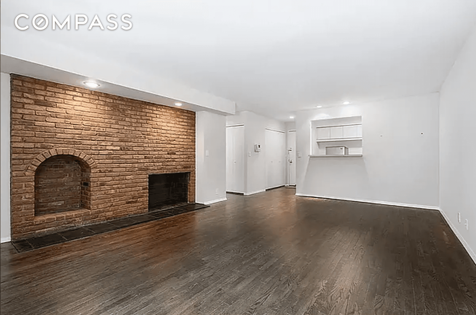 Pre war, landmarked, large 1 bedroom with storage and a washer amp ; dryer, a brick wall, a fireplace.