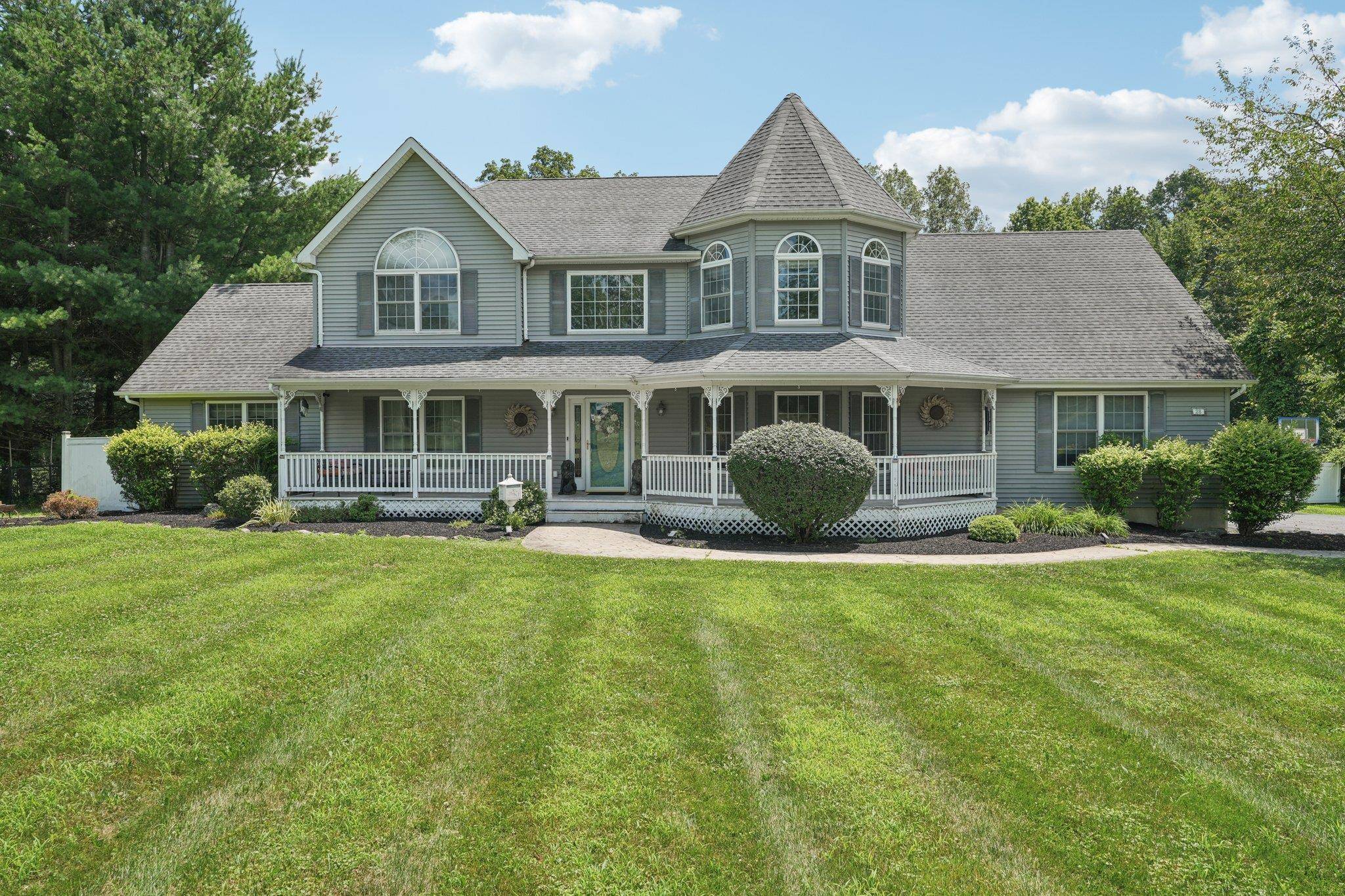 Welcome to this beautifully maintained Colonial nestled on more than 2 acres of serene, landscaped property.