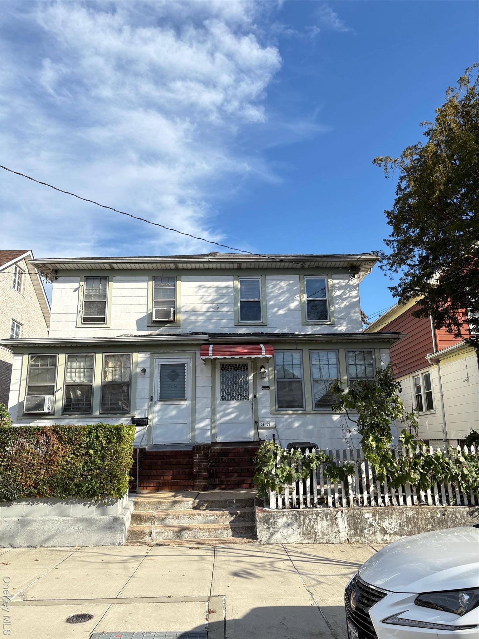 Semi attached house located two block from main street Flushing.