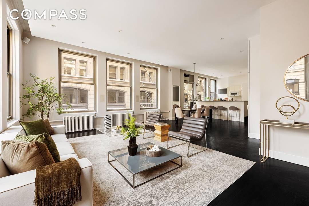 A rare, sun filled, full floor corner loft at 142 Fifth Avenue where historic Beaux Arts character meets refined modern living.