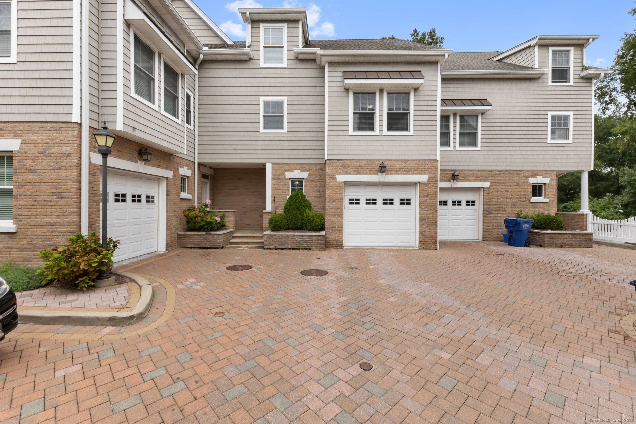 Welcome to The Maples, an exceptional townhome community tucked away in a private wooded enclave on the Darien border.