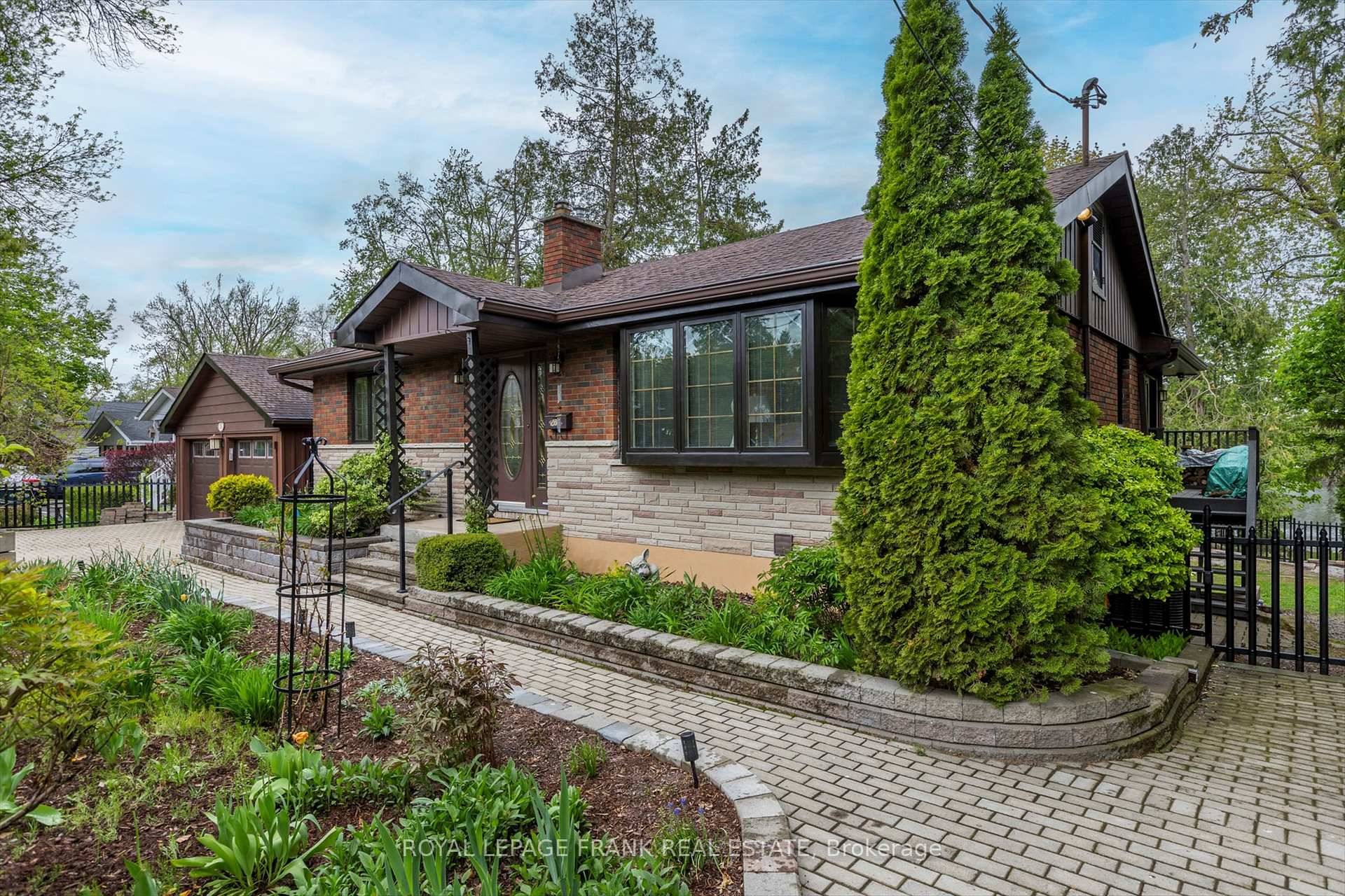 Combine home and cottage and enjoy waterfront tranquility in this charming bungalow, finished top to bottom, with breathtaking views from both levels over the Otonabee River.