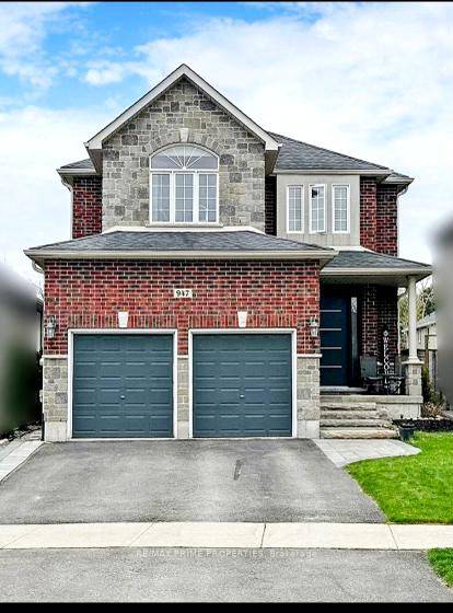 Welcome to this detached 4 bedroom, 4 bath home that is loaded with upgrades.