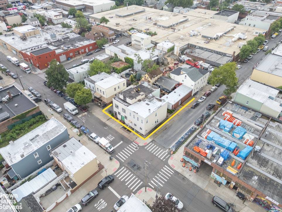 Rare Queens corner lot with significant air rights potential, existing mixed use buildings, and value add or ground up development options.