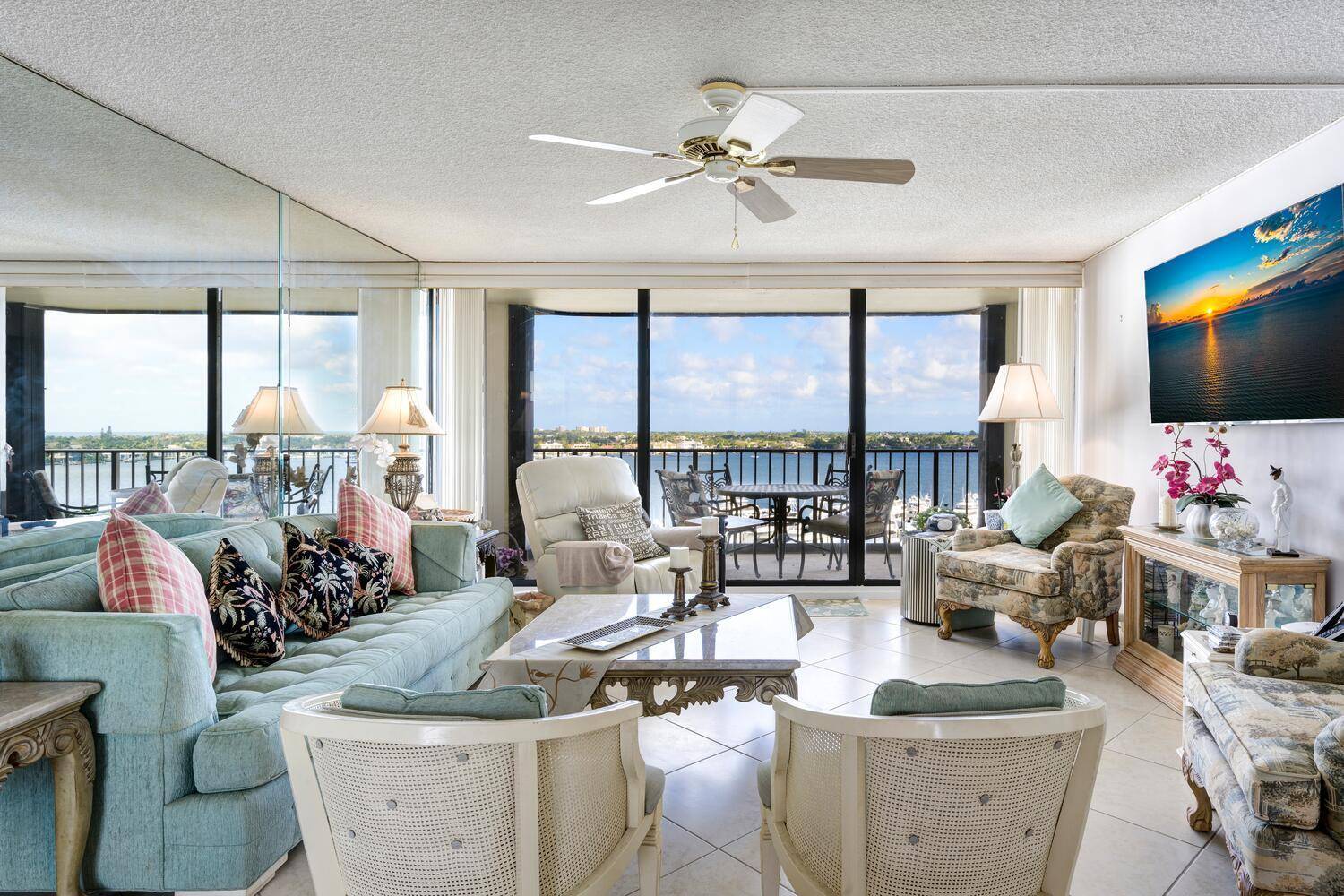 Assessments paid. Wake up to extraordinary sunrises from the full length balcony of this 10th floor two bedroom, two bath, well maintained condo in gated Old Port Cove.