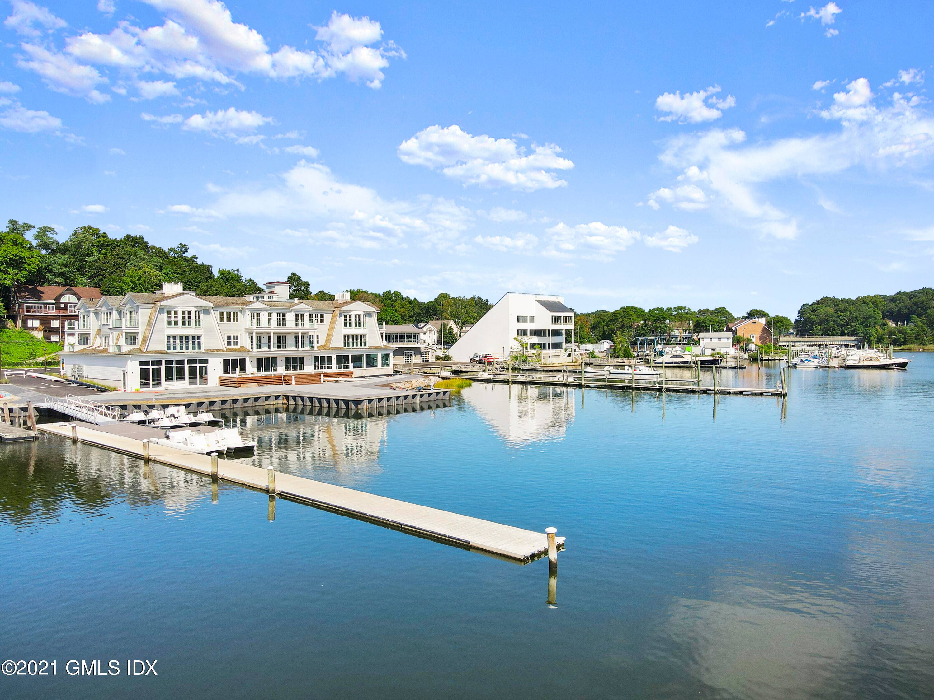 One of a kind direct Waterfront Shingle Style 12 unit condo association just completed and ready for summer occupancy.