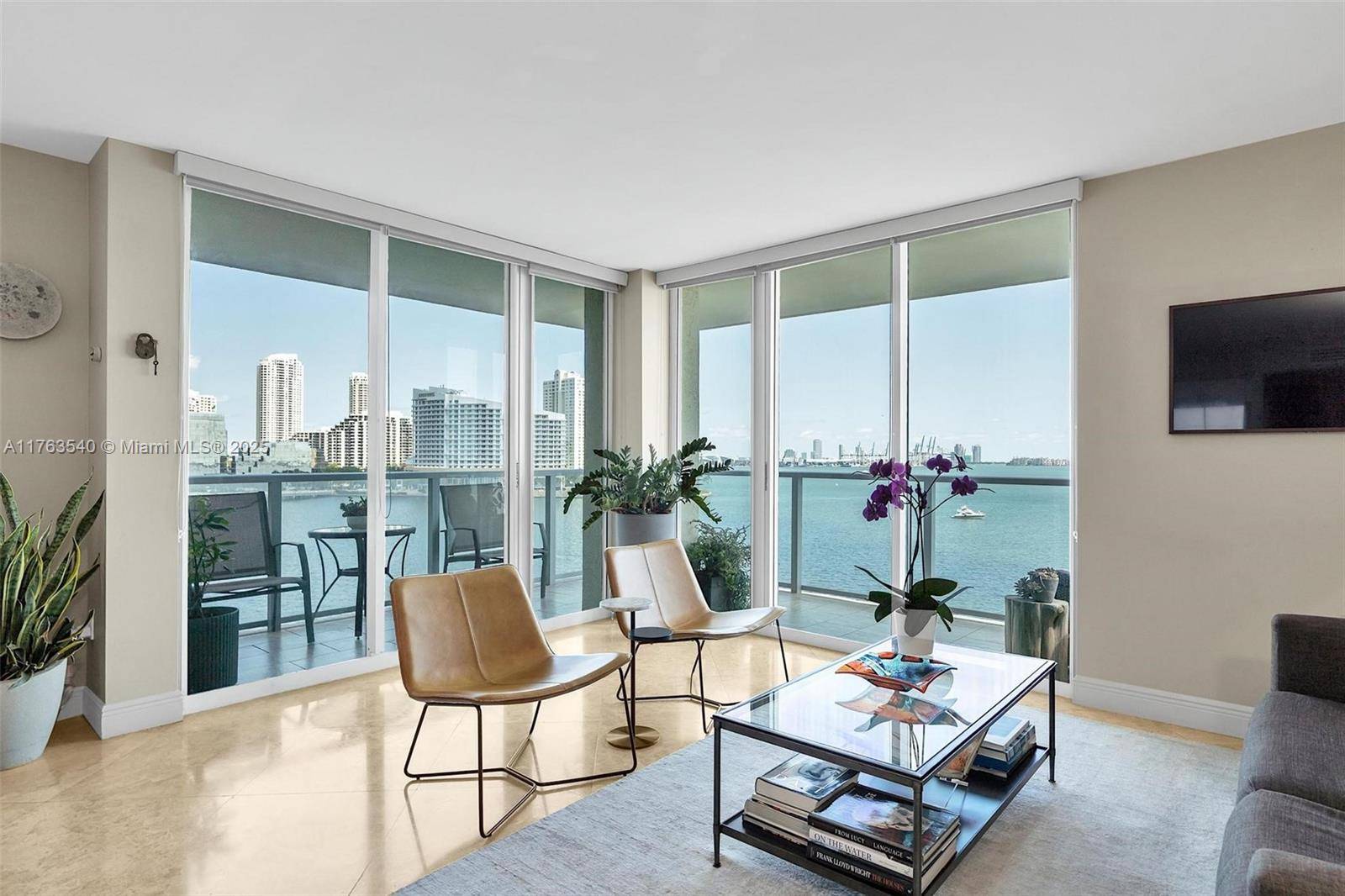 Endless bay views from this corner NE facing 2 bedroom, 2 bath condo at the Mark.