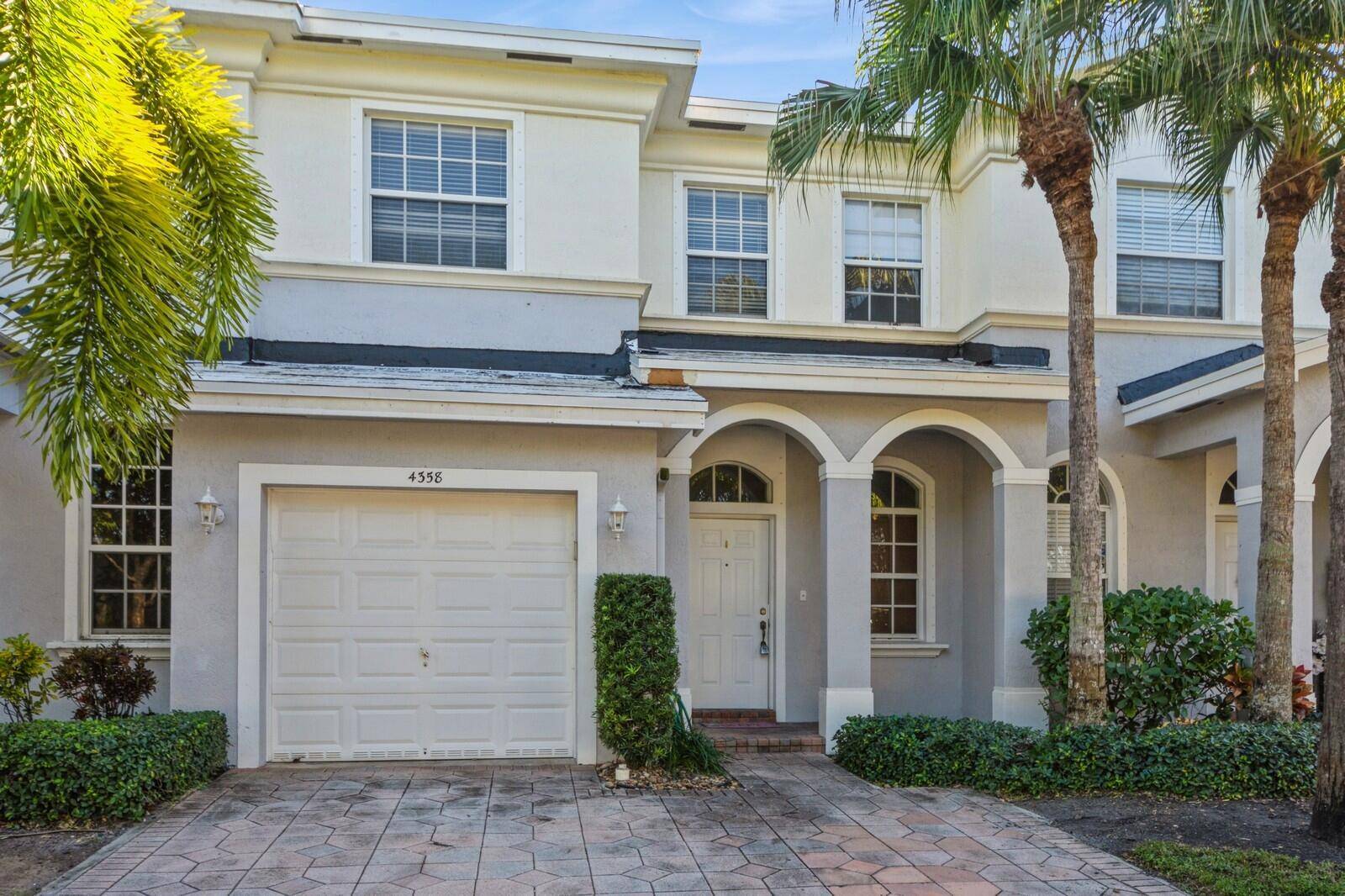 Stylish, Move in ready, Low HOA, 3 bedroom, 2 1 2 bath, garage townhome in vibrate Delray Beach.