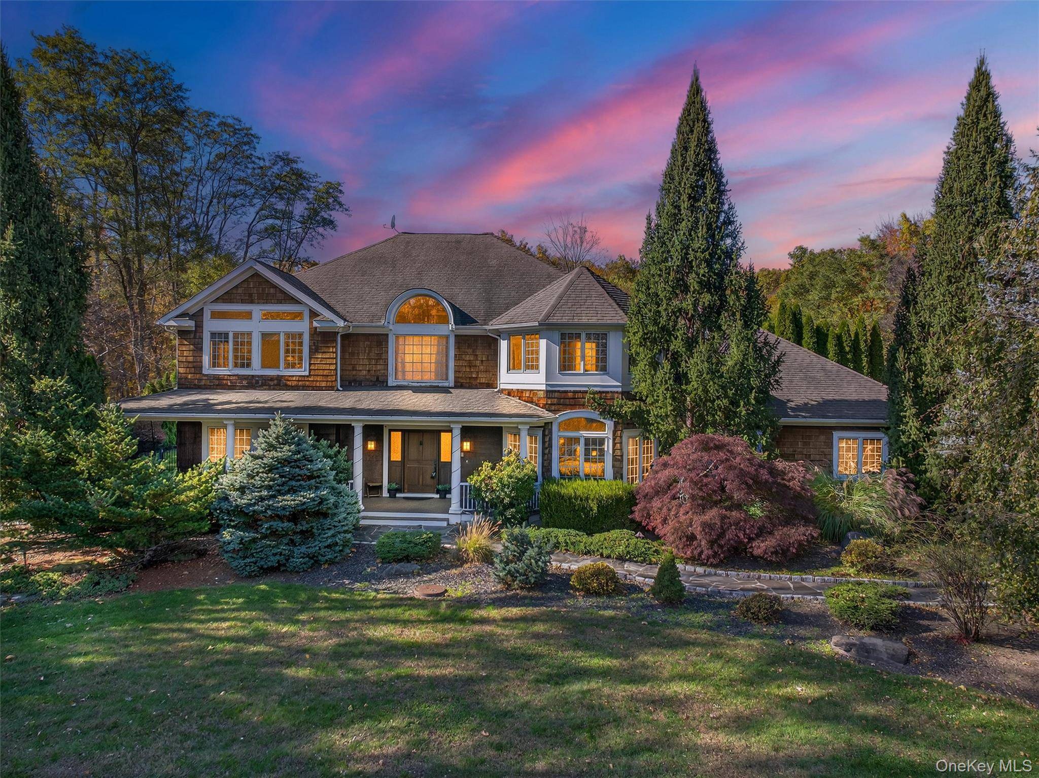 Experience timeless elegance in this custom built Nantucket shingle style colonial, privately set on a cul de sac in prestigious Village of Wesley Hills.