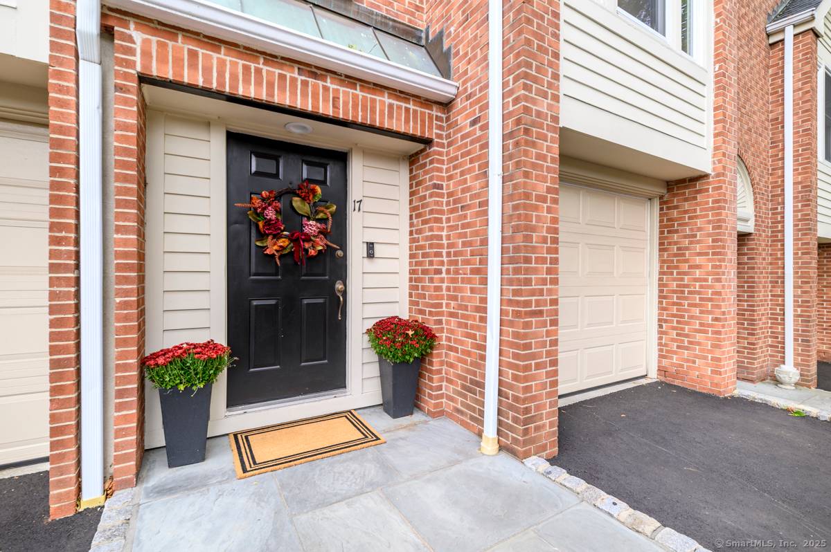 Walk to town or train from this elegant and fresh brownstone style townhome in Darien.