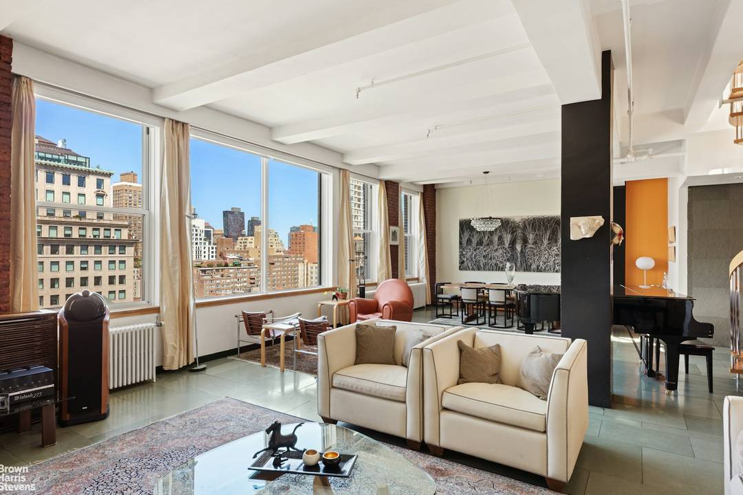 This massive 4, 000SF duplex penthouse loft is bathed in light from 4 exposures and offers unobstructed views of midtown Manhattan that are guaranteed to take your breath away !