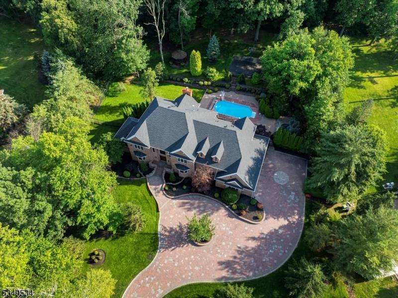 Behind a grand gated entrance, a heated paver driveway welcomes you home offering unmatched parking for up to 22 vehicles w o obstruction.